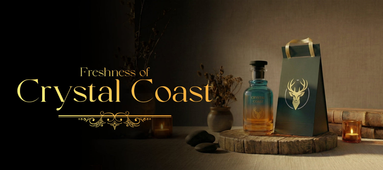 Bottle of alcohol, gift bag with deer design, and decorative elements on a wooden surface with 'Freshness of Crystal Coast' text.